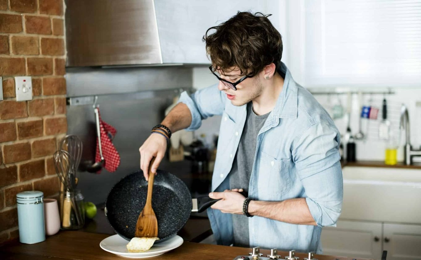 Caucasian man cooking in the kitchen