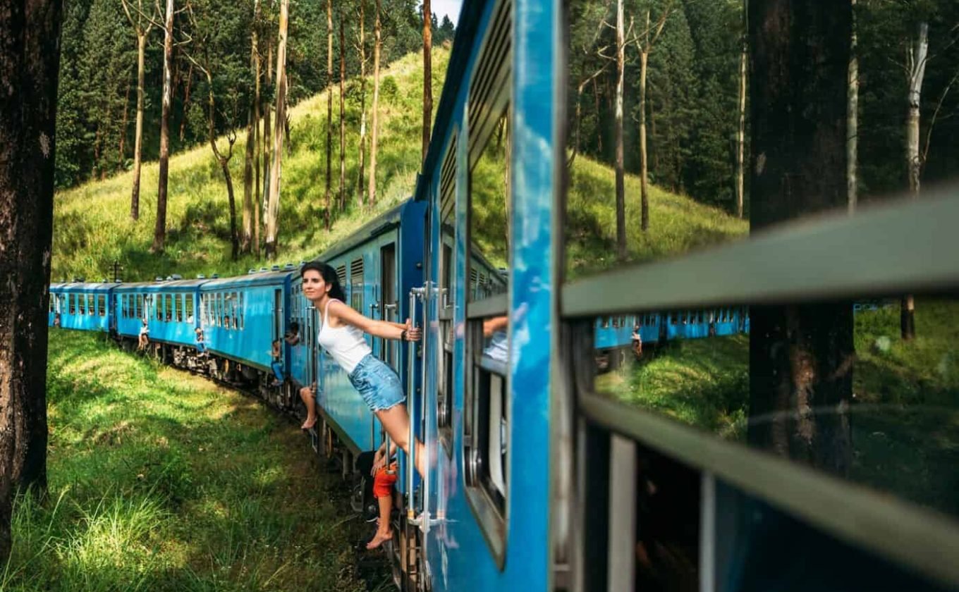 Travel by train. The girl travels by train to beautiful places